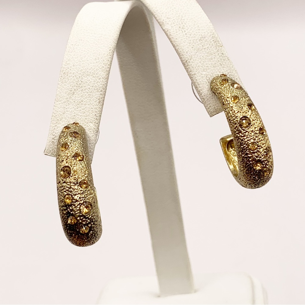 Monet textured gold tone half hoop earrings with champagne rhinestones